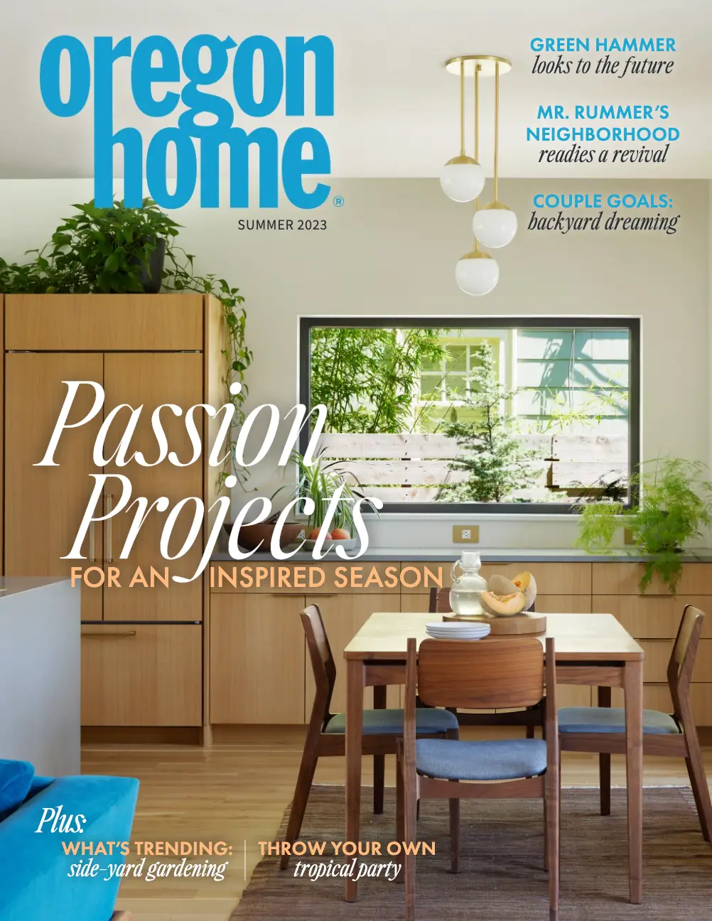 The cover of the Summer 2023 issue of Oregon Home magazine. The cover features a modern, natural-toned dining and kitchen area with large windows looking out onto a lush, green yard.