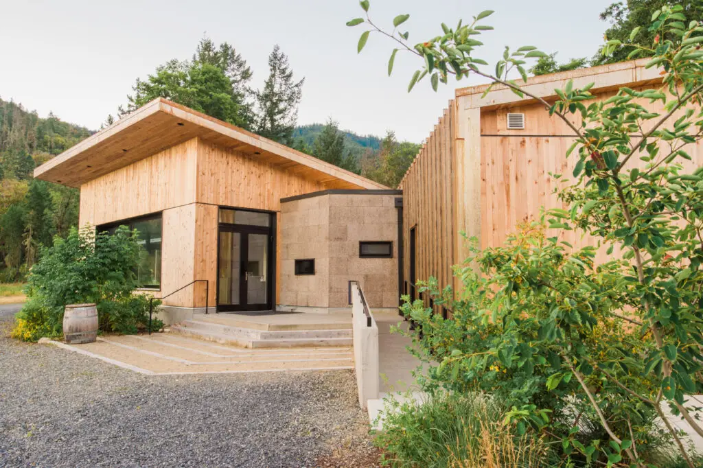 Cowhorn Vineyard and Garden exterior showing wood cladding, cork cladding and metal panel