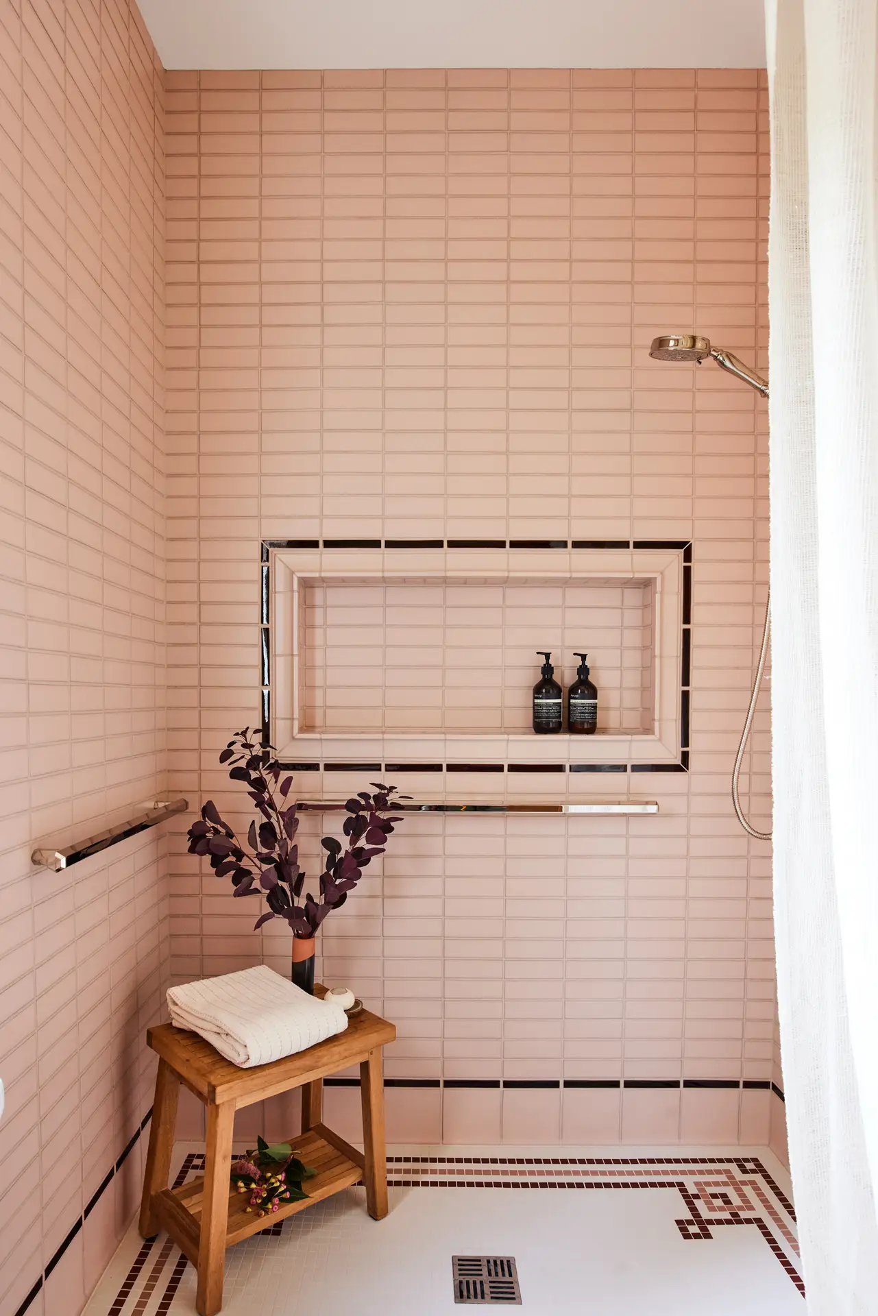 Willamette Heights House Shower, featuring horizontally oriented link pink wall tile with intricate floor and shower nook detailing.