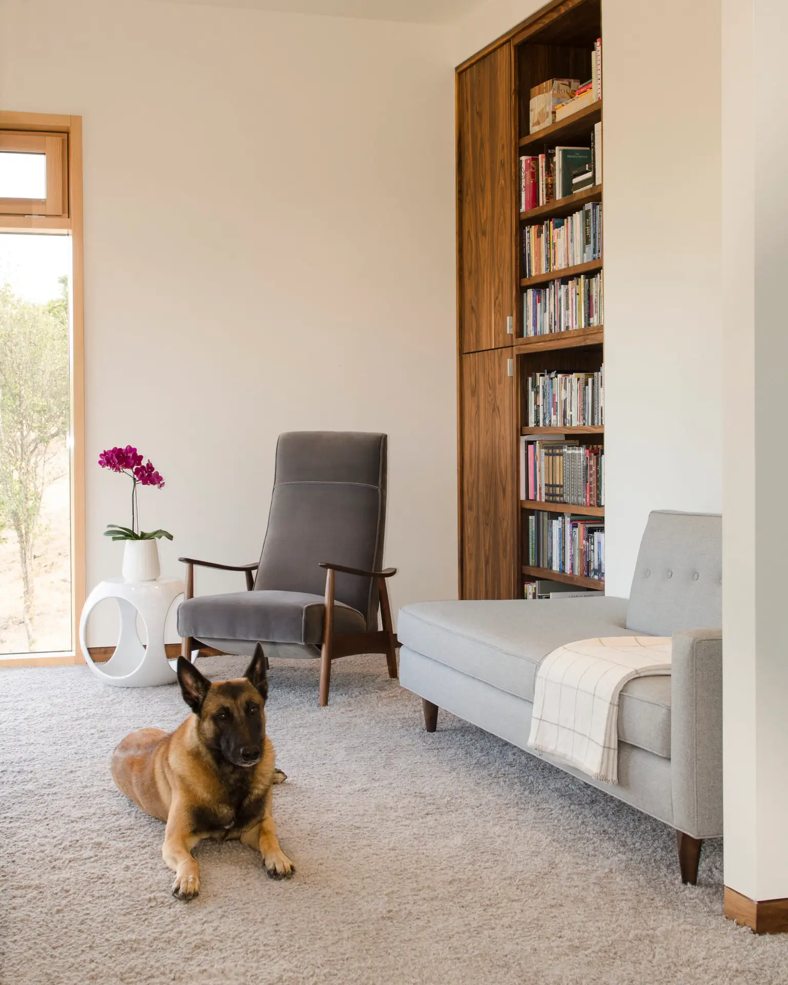 Fineline Custom Home study with a seating area, built-in floor to ceiling cabinetry.