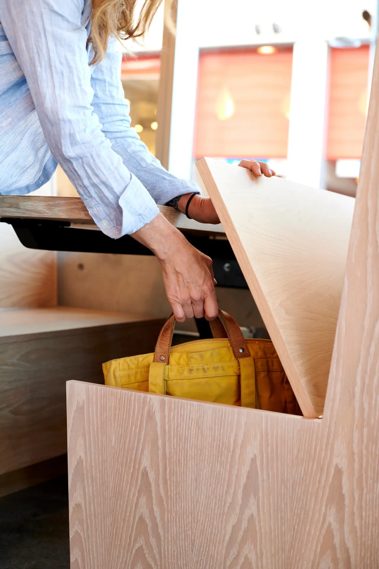 Custom wooden benches that open up for storage at Olia Poke.