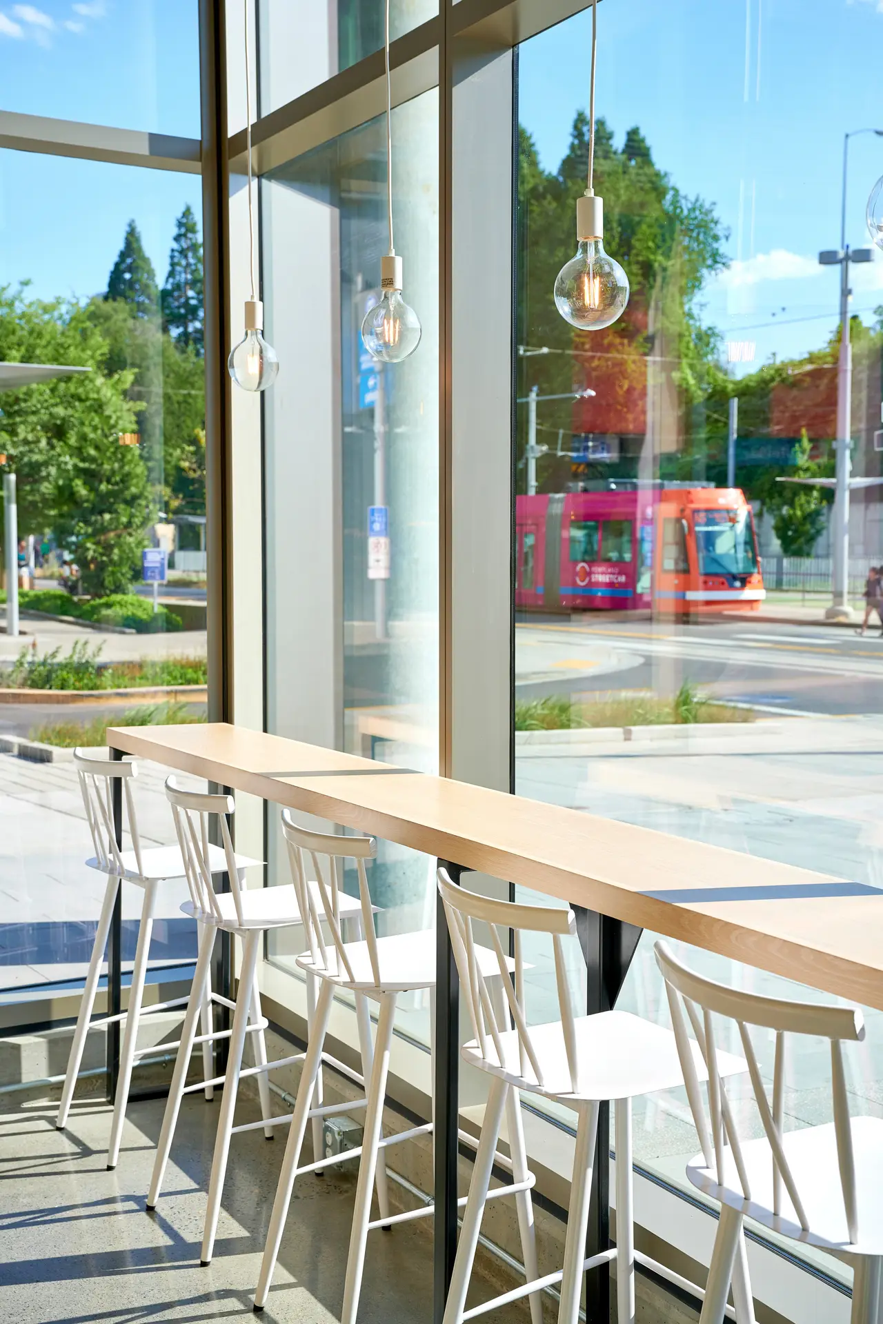 Counter top tables over looking the street at Olia Poke