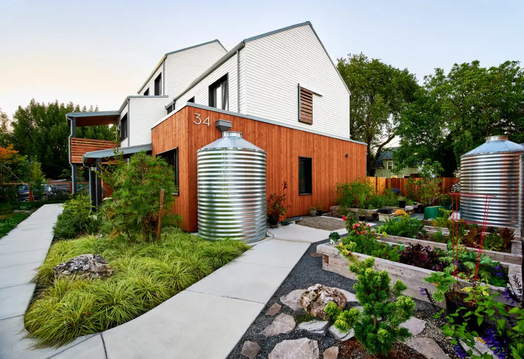 Tillamook Row, featuring a beautifully landscaped exterior with garden boxes as well as rainwater collection tanks.