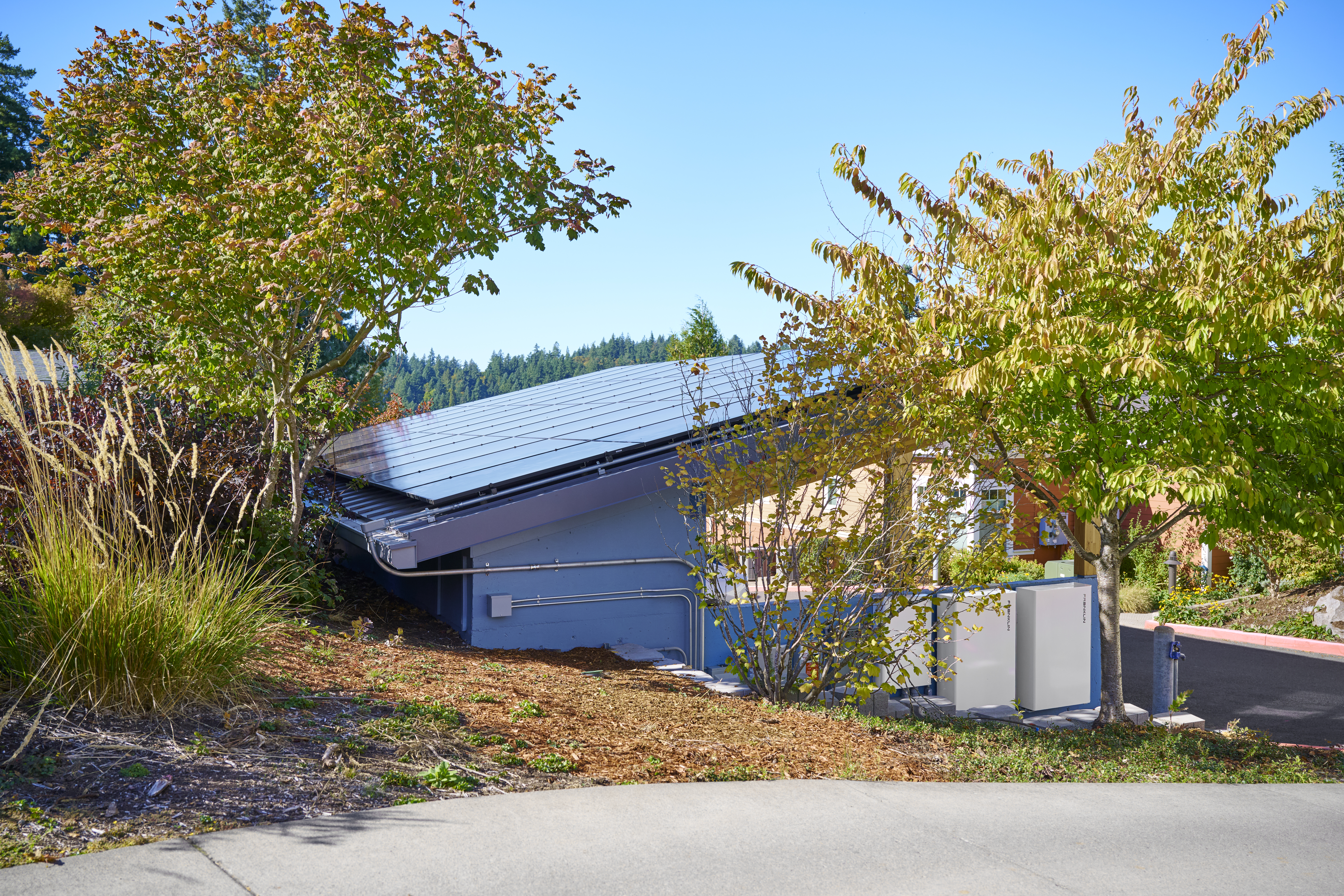 A view of the 17.82 kW rooftop solar array and wall mounted battery storage.