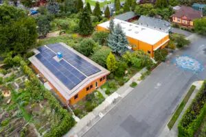 Solar panels on the roof of New Day School and the surrounding landscape.