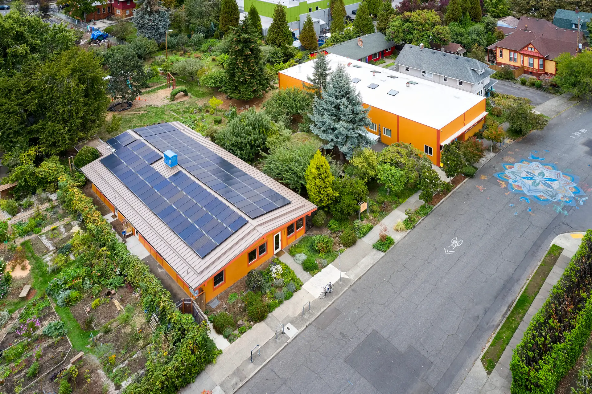 Solar panels on the roof of New Day School and the surrounding landscape.